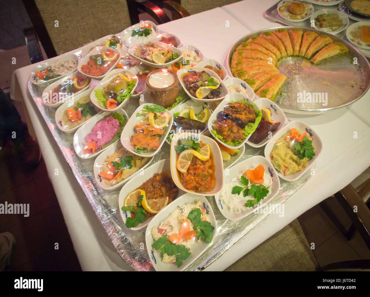 Fine dining in Baku Azerbaijan, a variety of starters and sweets to choose from Stock Photo