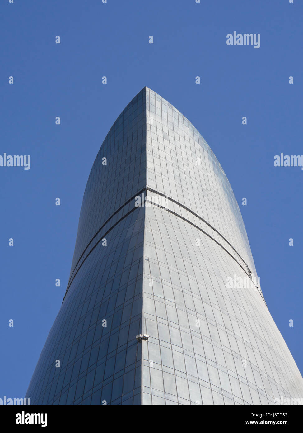 Looking up one of the Flame towers skyscrapers in Baku Azerbaijan, a towering landmark of modern architecture Stock Photo