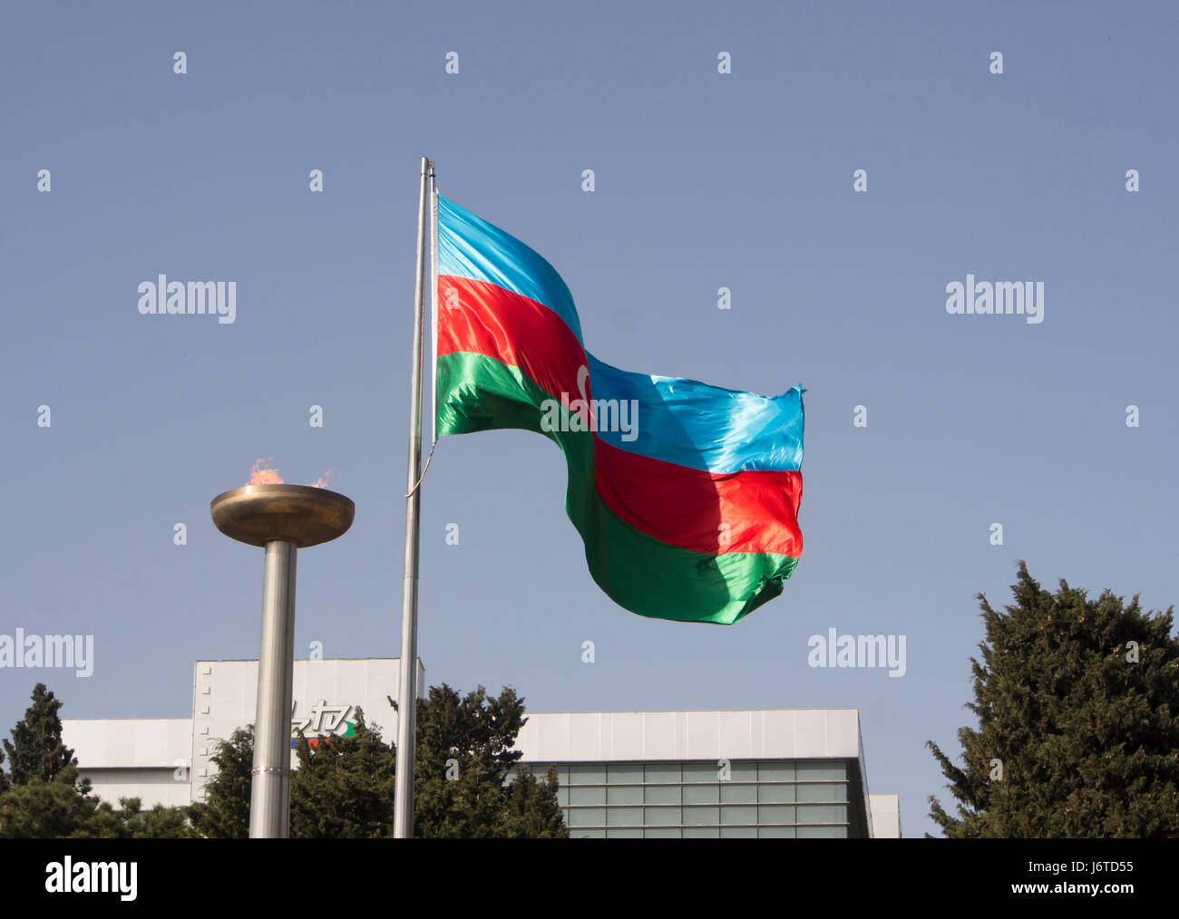 Azerbaijani flag and flame at the entrance to the Martyrs' Lane memorial and cemetery in The capital Baku Stock Photo