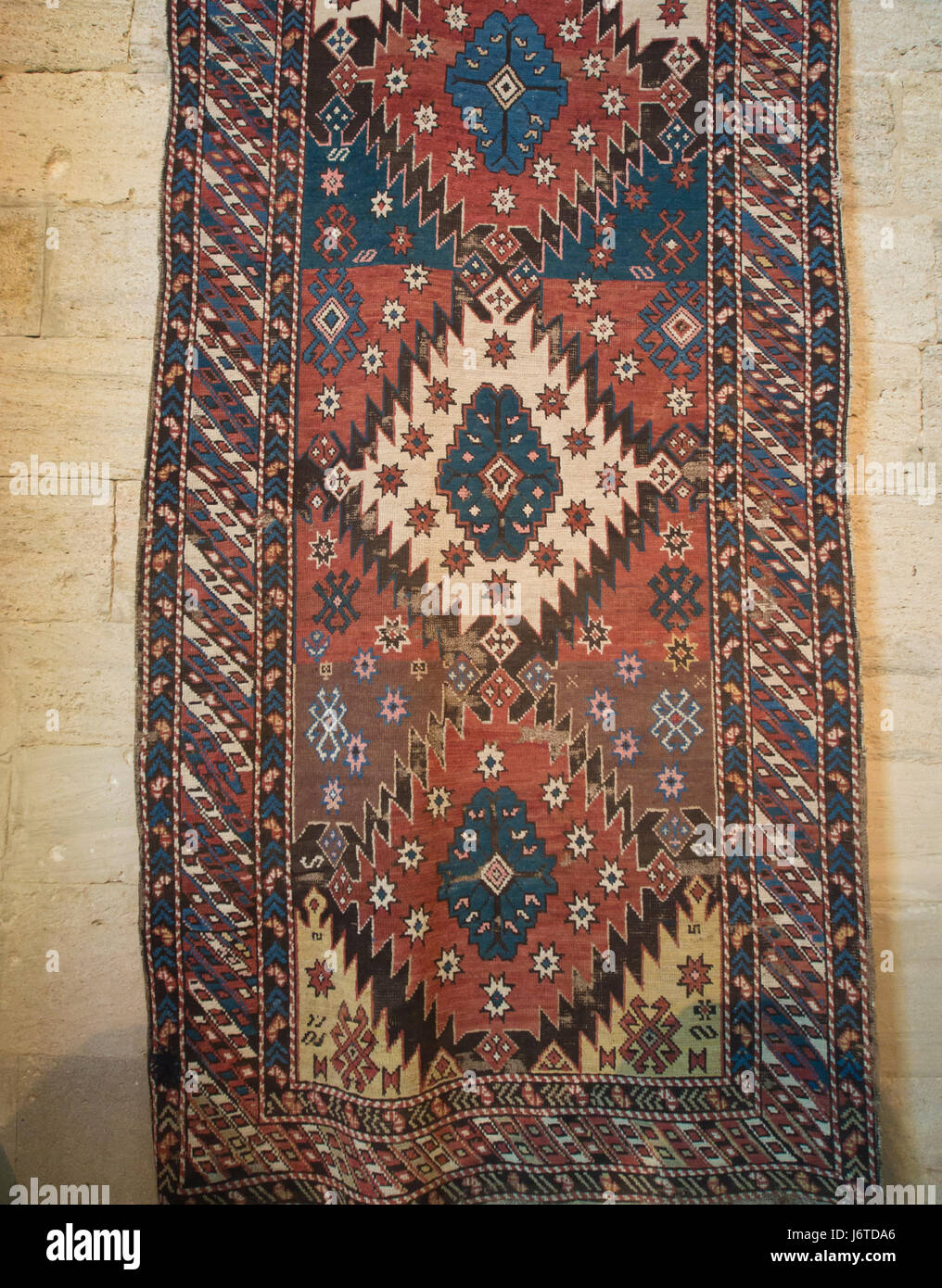 Palace of the Shirvanshahs, a Unesco world heritage site in the old walled city in Baku Azerbaijan, yollug 19th century carpet in the museum Stock Photo