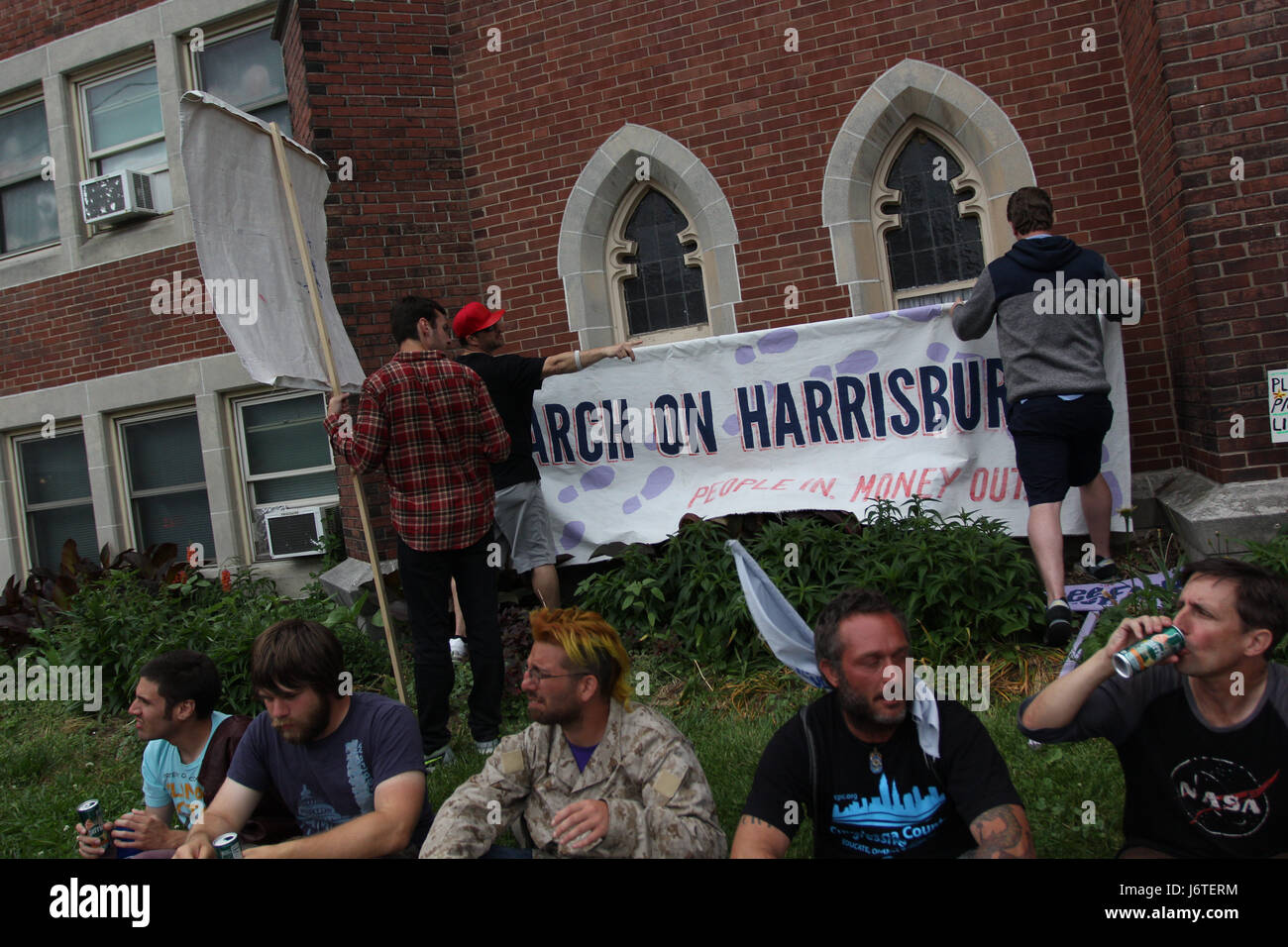 Harrisburg, PA., 21st May, 2017. A group of demonstrators, some of whom marched more than 100 miles from Philadelphia over the course of nine days, celebrate after arriving at the Unitarian Church of Harrisburg in Harrisburg, PA, Sunday, May 21, 2017. The organizers plan on staging actions at the State Capitol building starting Monday, including planned civil disobedience. Credit: Michael Candelori/Alamy Live News Stock Photo