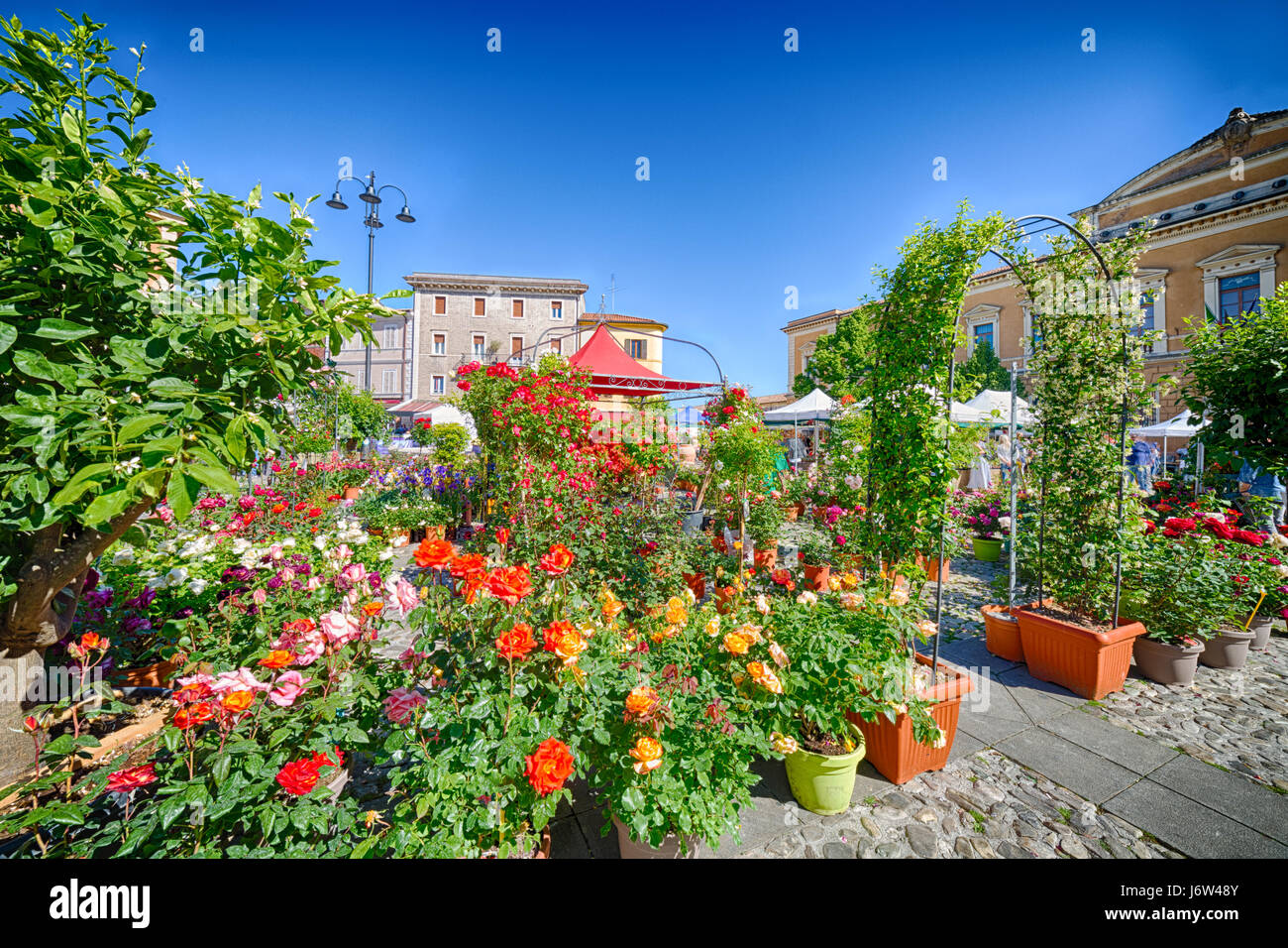 Flower fair in medieval village in Italy Stock Photo - Alamy