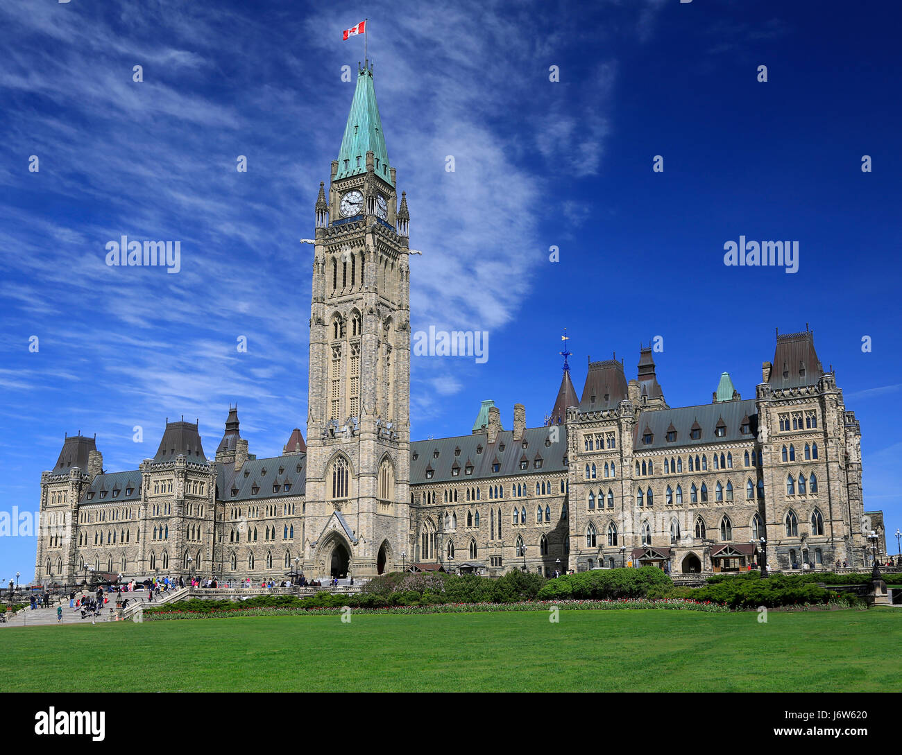 The Parliament of Canada, Peace Tower surrounded by red tulips Stock Photo