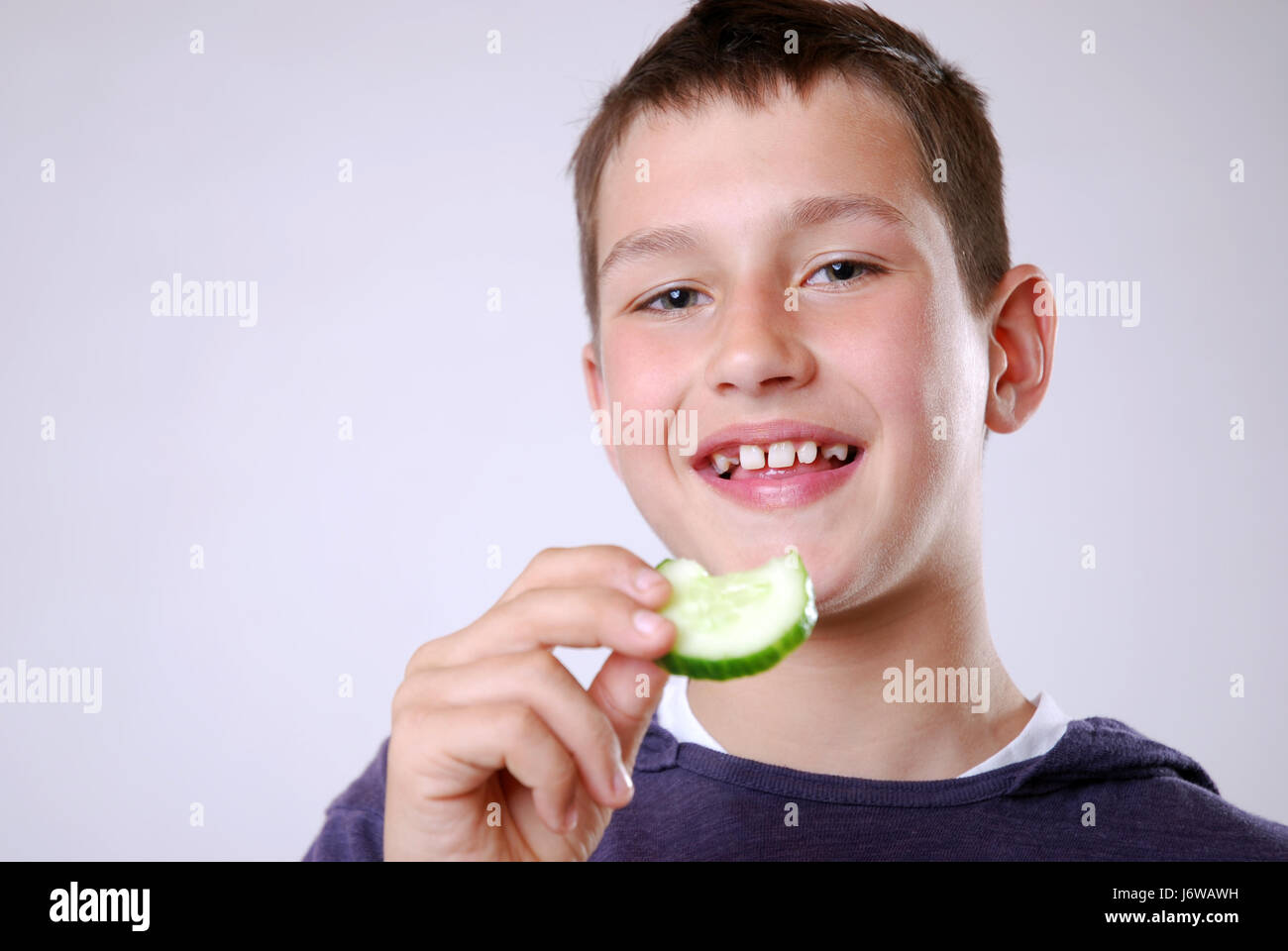 eating cucumber Stock Photo