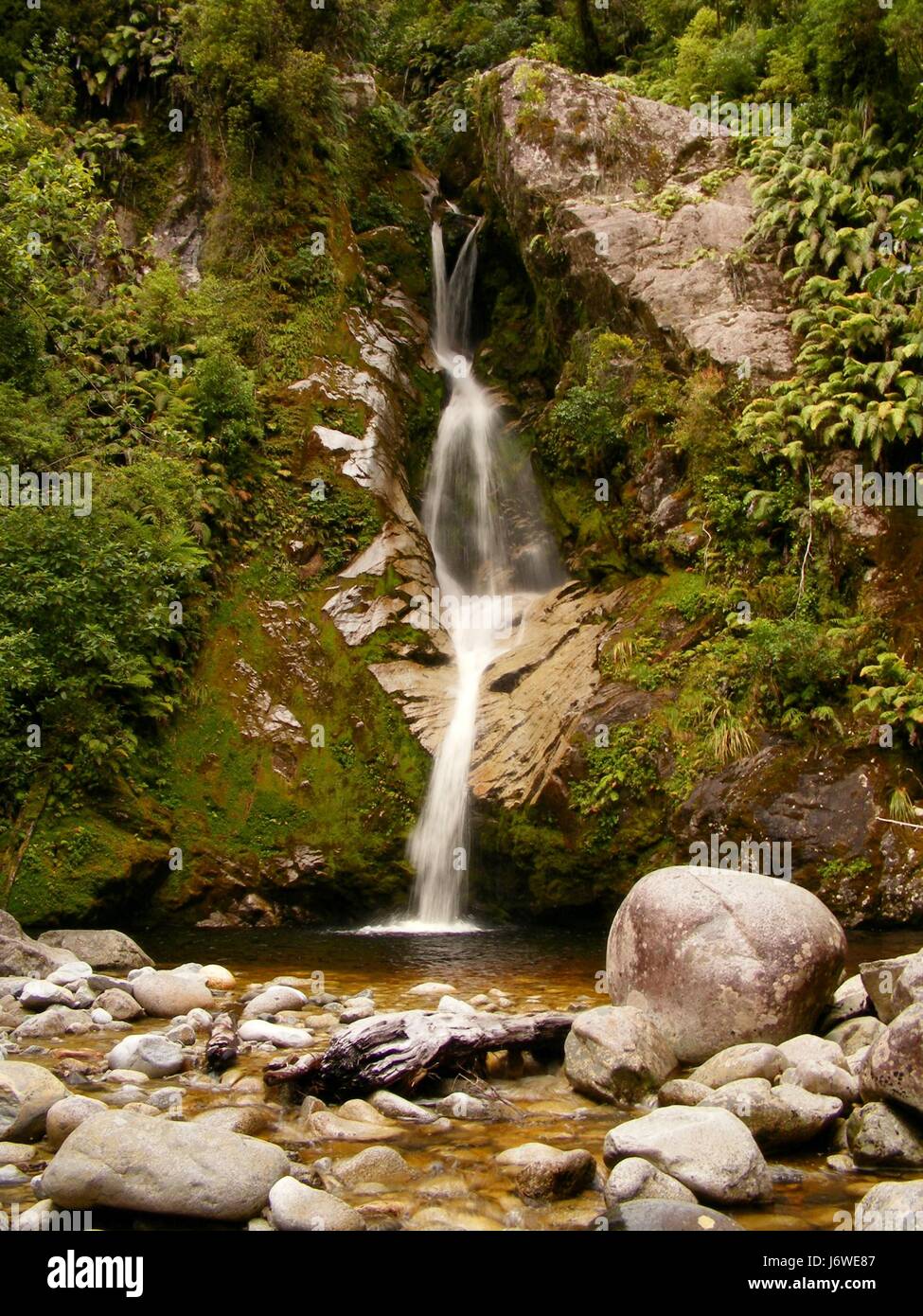 waterfall valley new zealand steep torrent group mountain blue