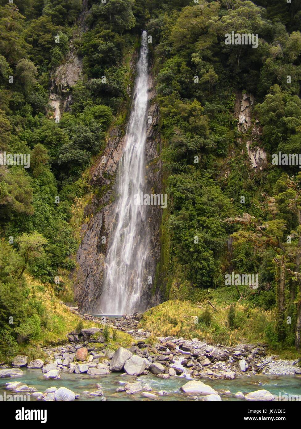 waterfall valley new zealand steep torrent group mountain blue