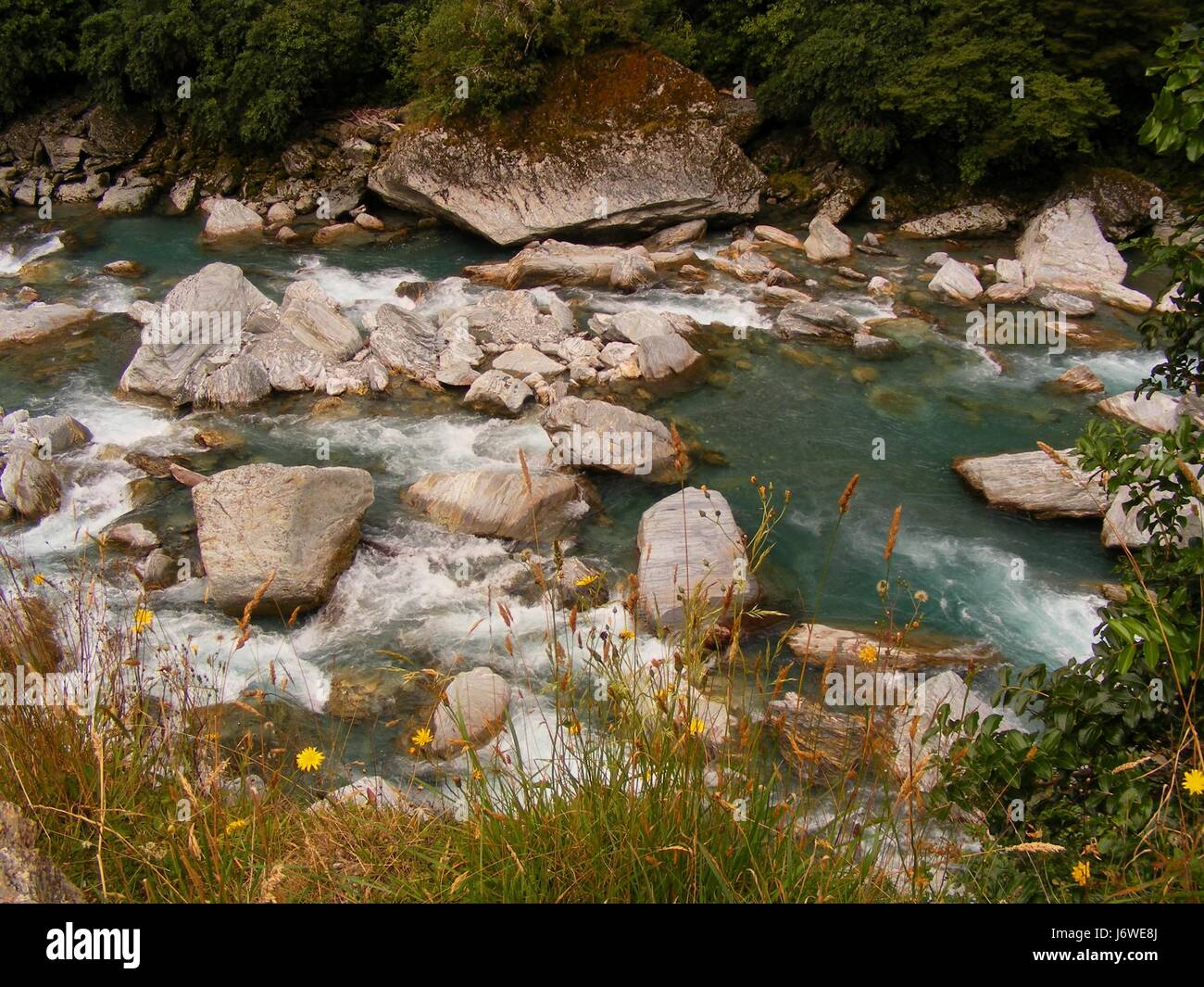 waterfall valley new zealand steep torrent group mountain blue