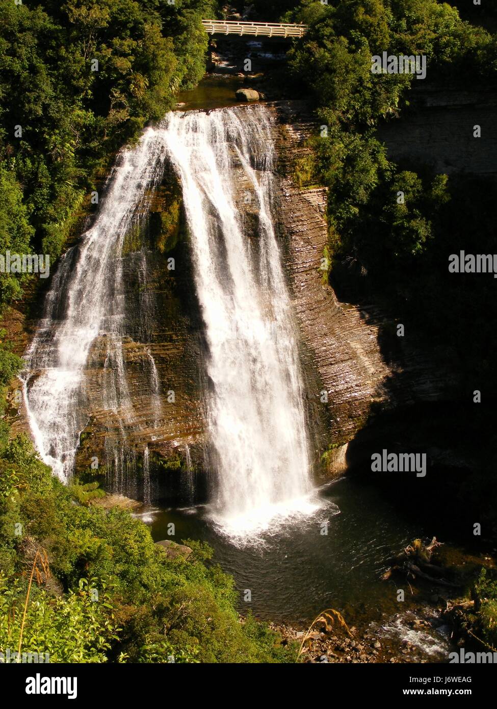 waterfall valley new zealand steep torrent group mountain blue