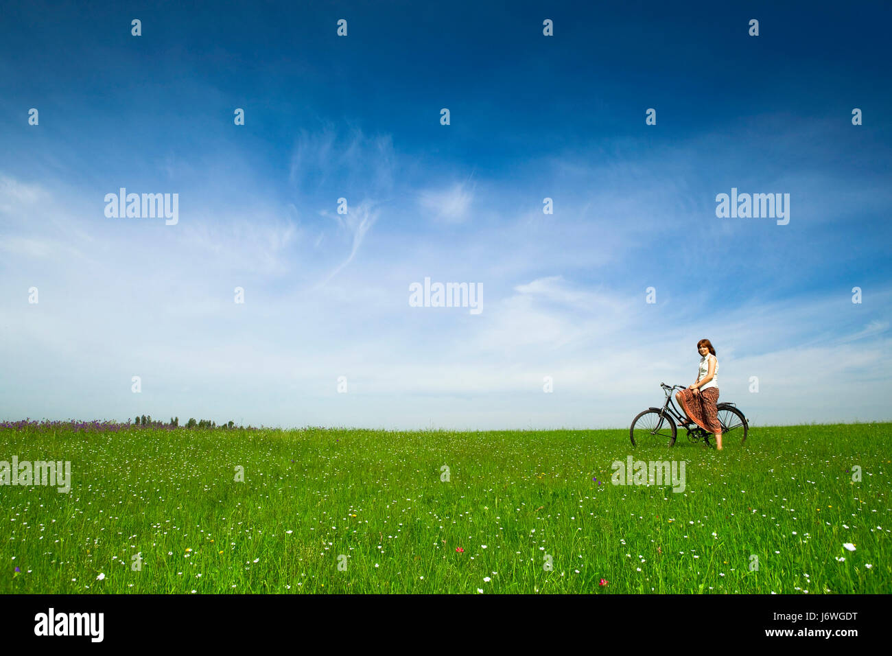 woman field spring bouncing bounces hop skipping frisks jumping jump ...
