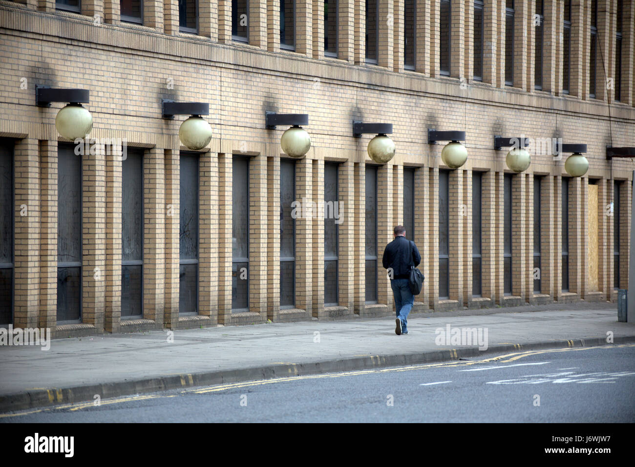 single man walking in perspective street urban cityscape Stock Photo