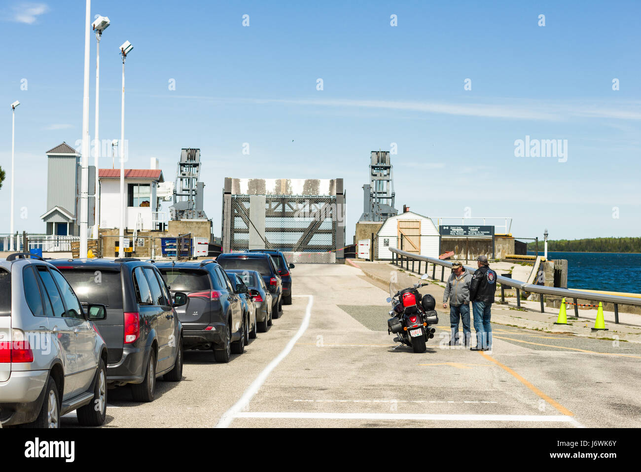Vehicles And Passengers Waiting In Line At South Baymouth Ferry