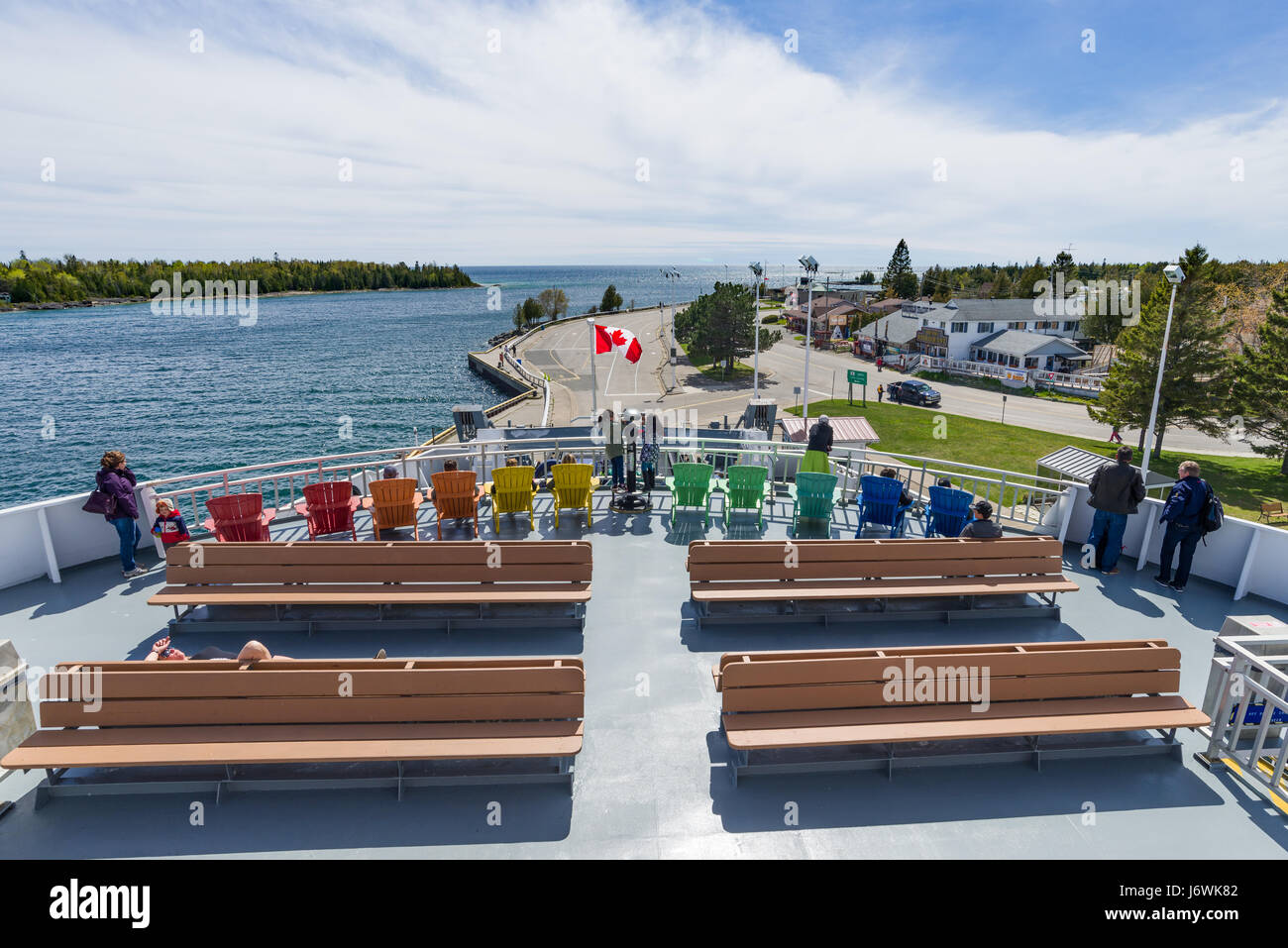 Passengers On Top Deck Watching As The ChiCheemaun Ferry Departs South Baymouth Ferry Terminal