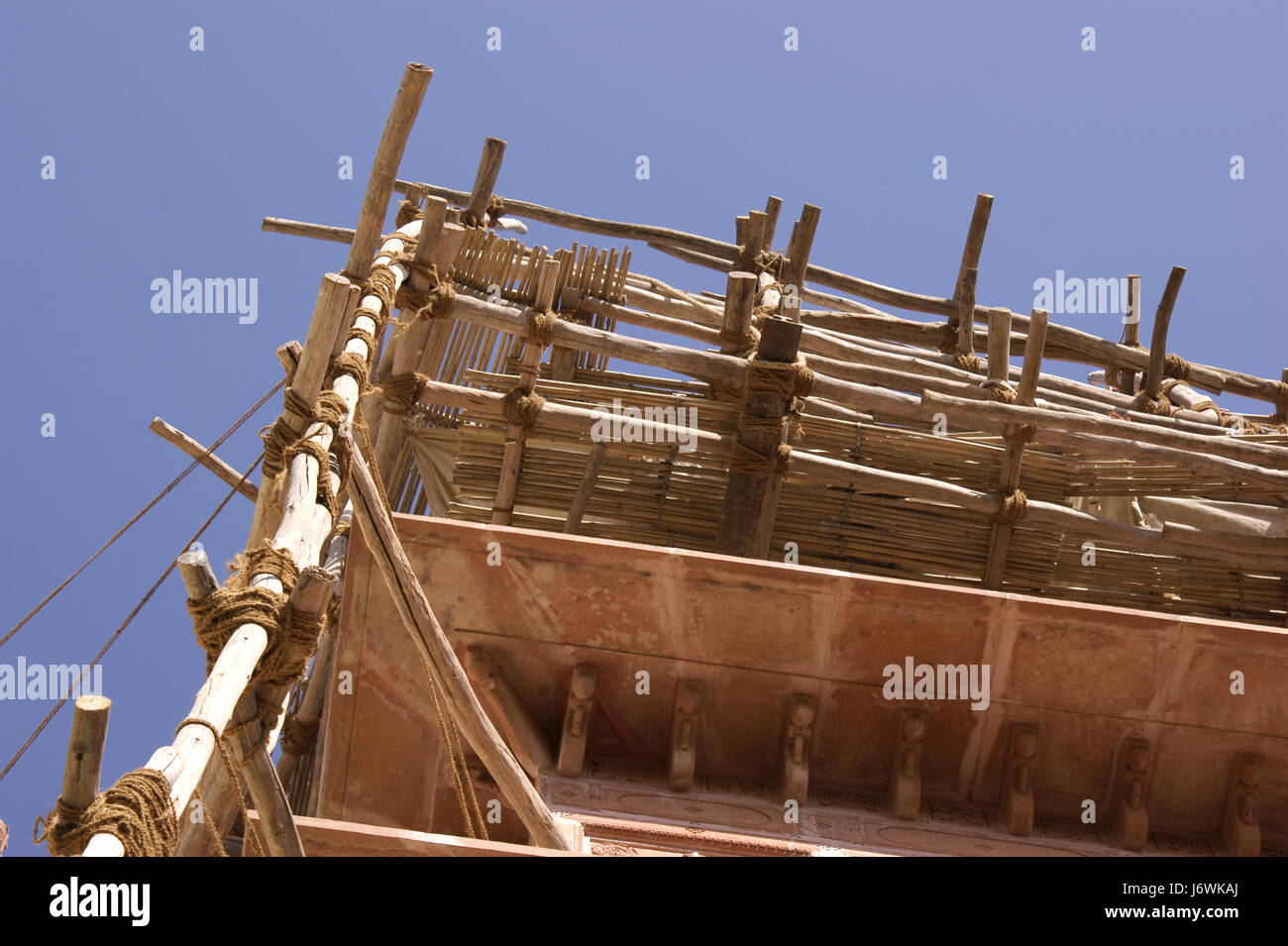 indian scaffolding,wooden sticks tied with ropes Stock Photo