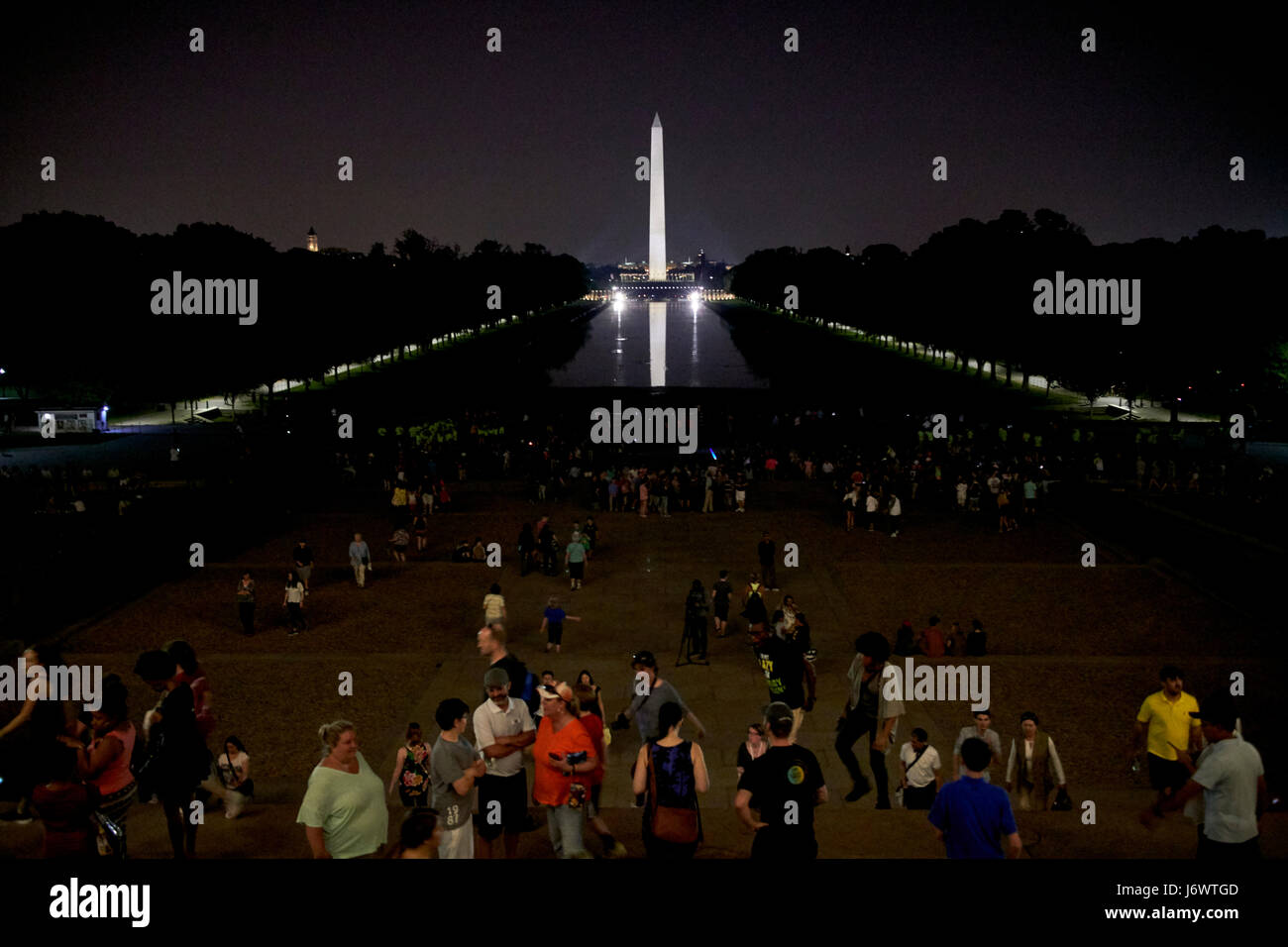 looking out of the lincoln memorial along the national mall and reflecting pool at night Washington DC USA Stock Photo
