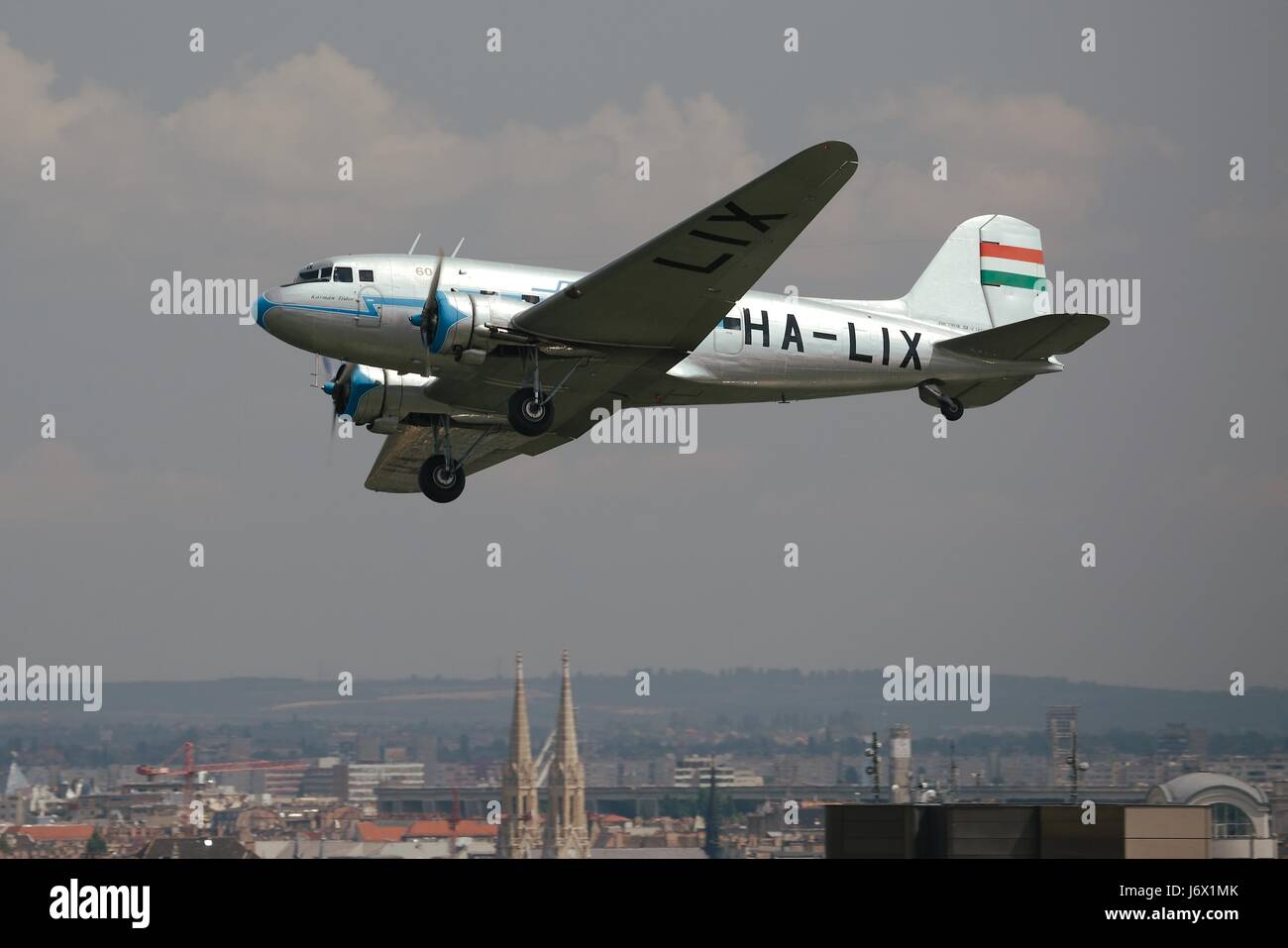BUDAPEST, HUNGARY - MAY 1, 2014: Li-2 aircraft flying over Budapest. This aircraft is 65 years old, Soviet version of the legendary DC-3 Stock Photo