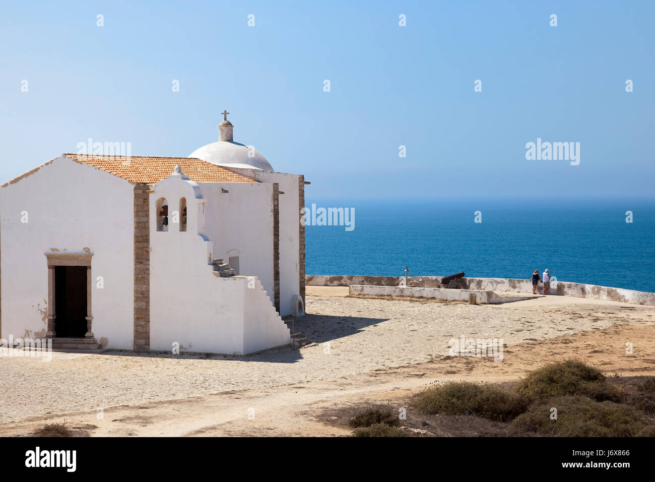 church chapel longing portugal steep coast cliff blue stairs travel religion Stock Photo
