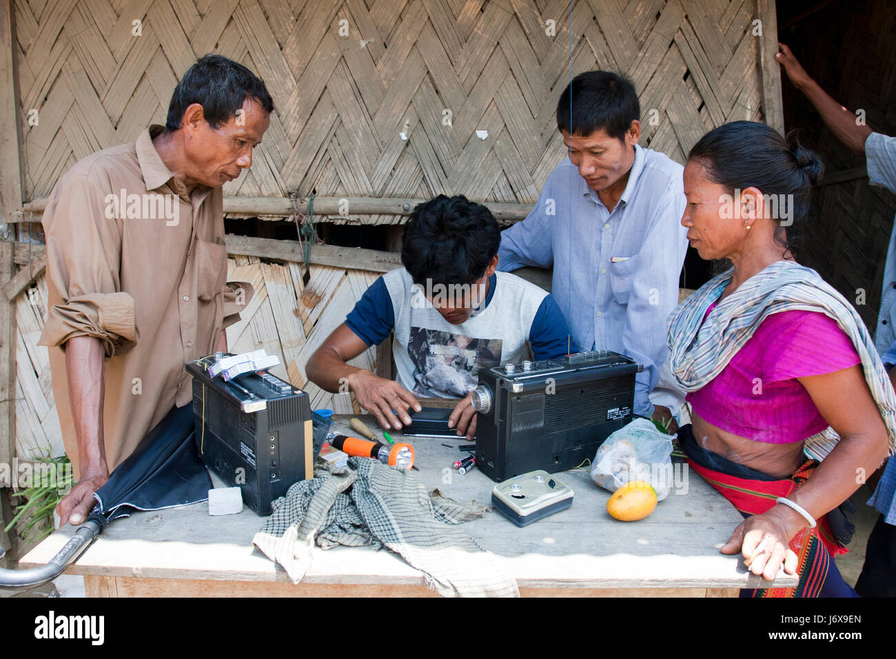 An ethnic technician works at his workshop. Khagrachari, Bangladesh. Stock Photo