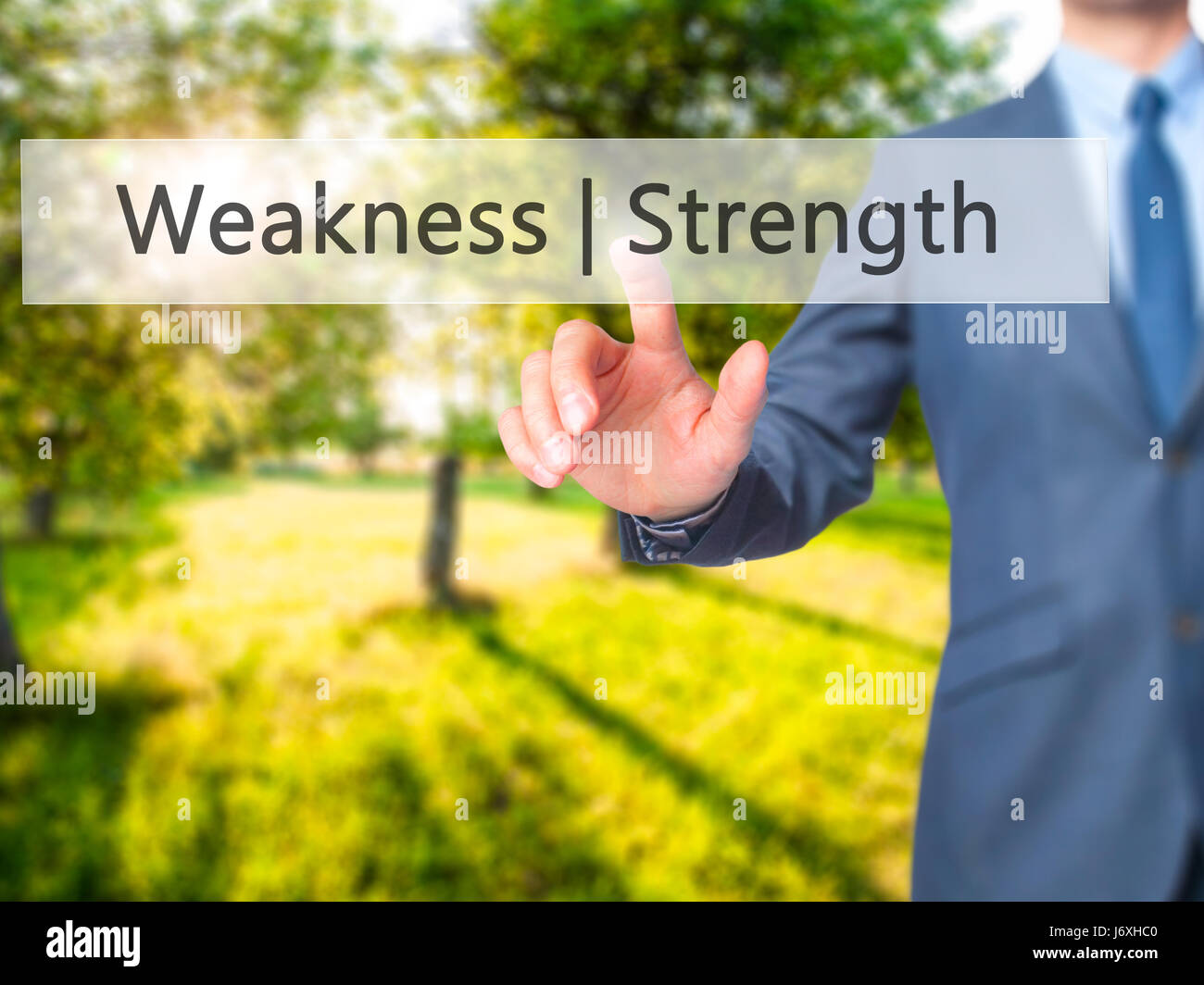 Weakness Strength - Businessman hand pressing button on touch screen ...