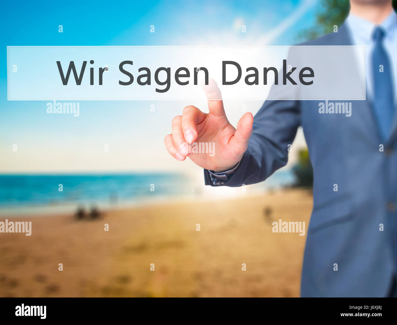 Wir Sagen Danke (We Say Thank You In German) - Businessman hand touch