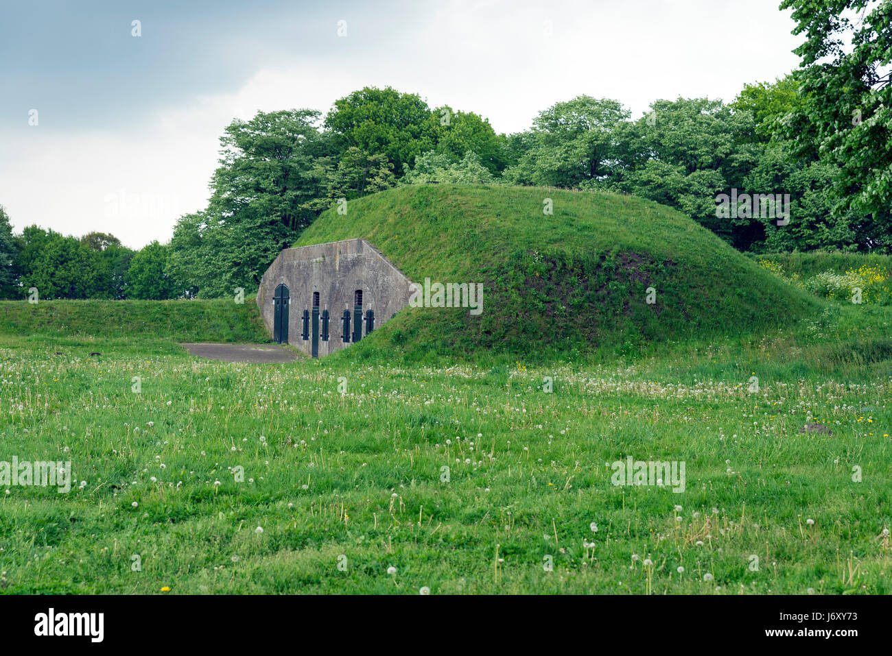 NAARDEN - NETHERLANDS - MAY 13, 2017: Naarden is an example of a star fort, complete with fortified walls and a moat. The moat and walls have been res Stock Photo