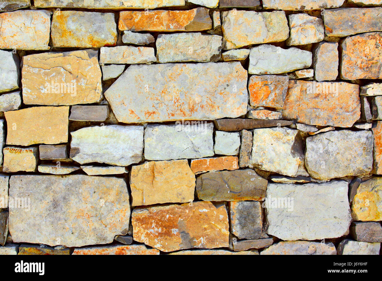 Texture of colourful dry masonry, may be used as background Stock Photo