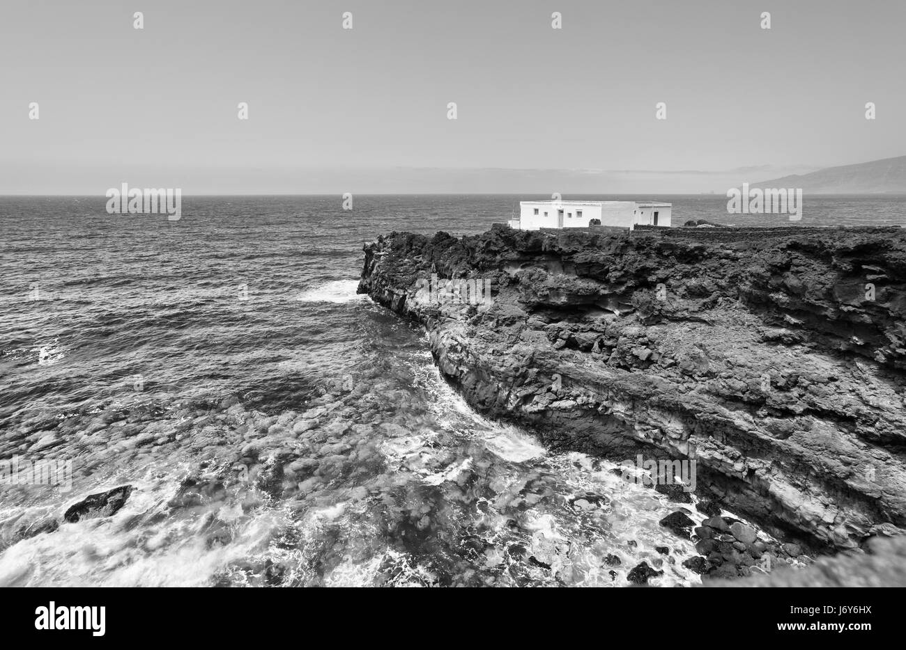 House at world's end. Lonely small house on a rocky shore of Atlantic Ocean.  El Hierro Island, Canaries Stock Photo