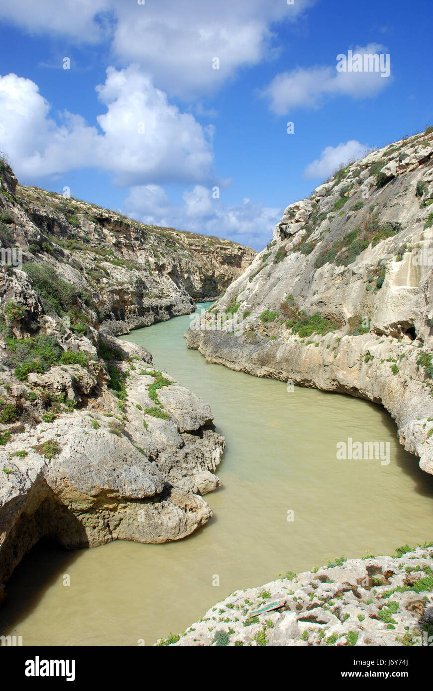 rock malta ravine bay firmament sky water clouds blue holiday vacation ...