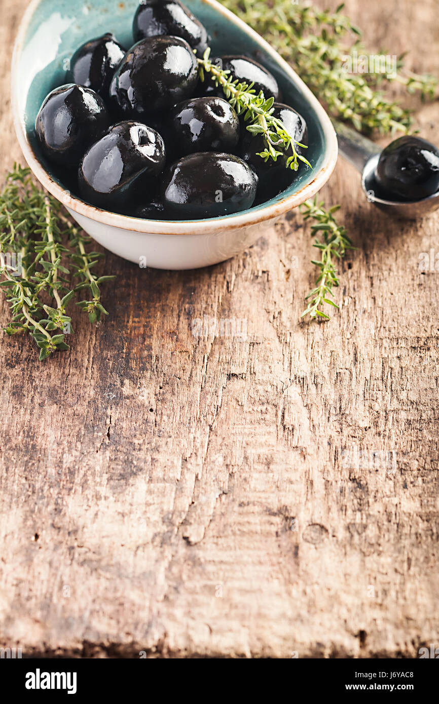 Bowl filled with fresh black olives Stock Photo Alamy