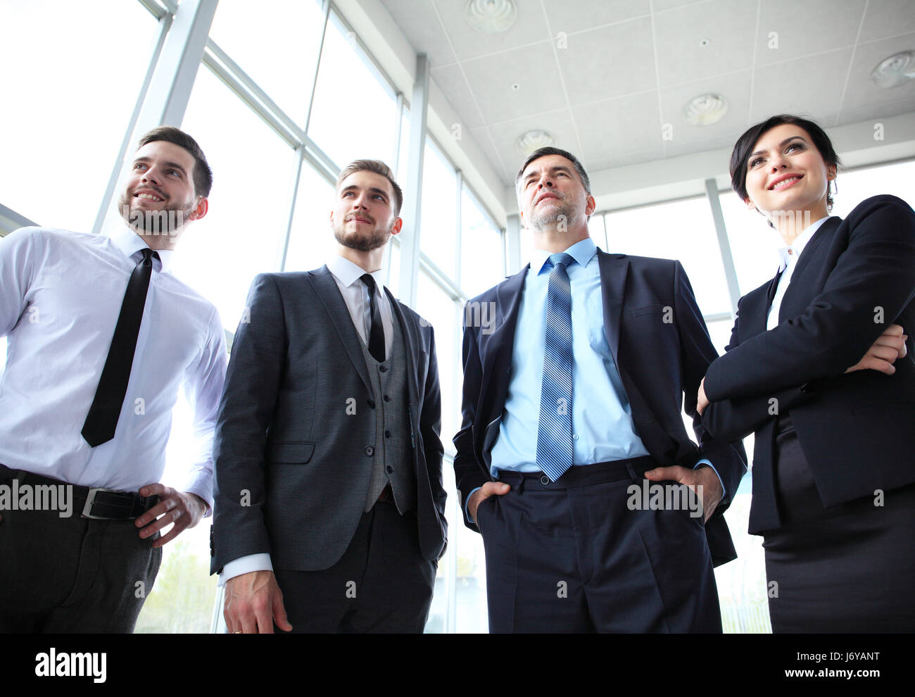 Happy smiling business team in office - business concept Stock Photo ...