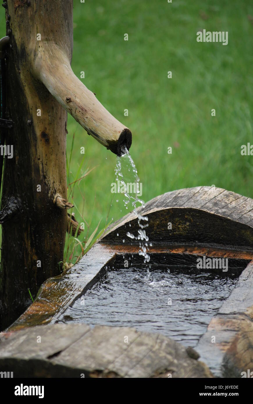 fountain jet of water water flow ceramic tiles fountain squirt gurgle jet  of Stock Photo - Alamy