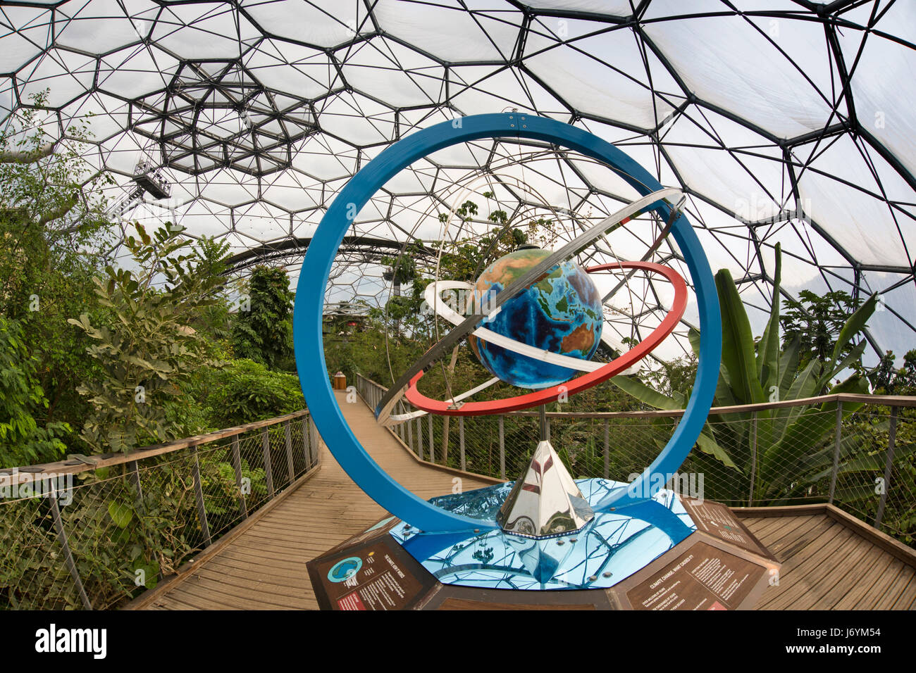 UK, Cornwall, St Austell, Bodelva, Eden Project, Rainforest Biome, globe climate change sculpture on elevated walkway Stock Photo