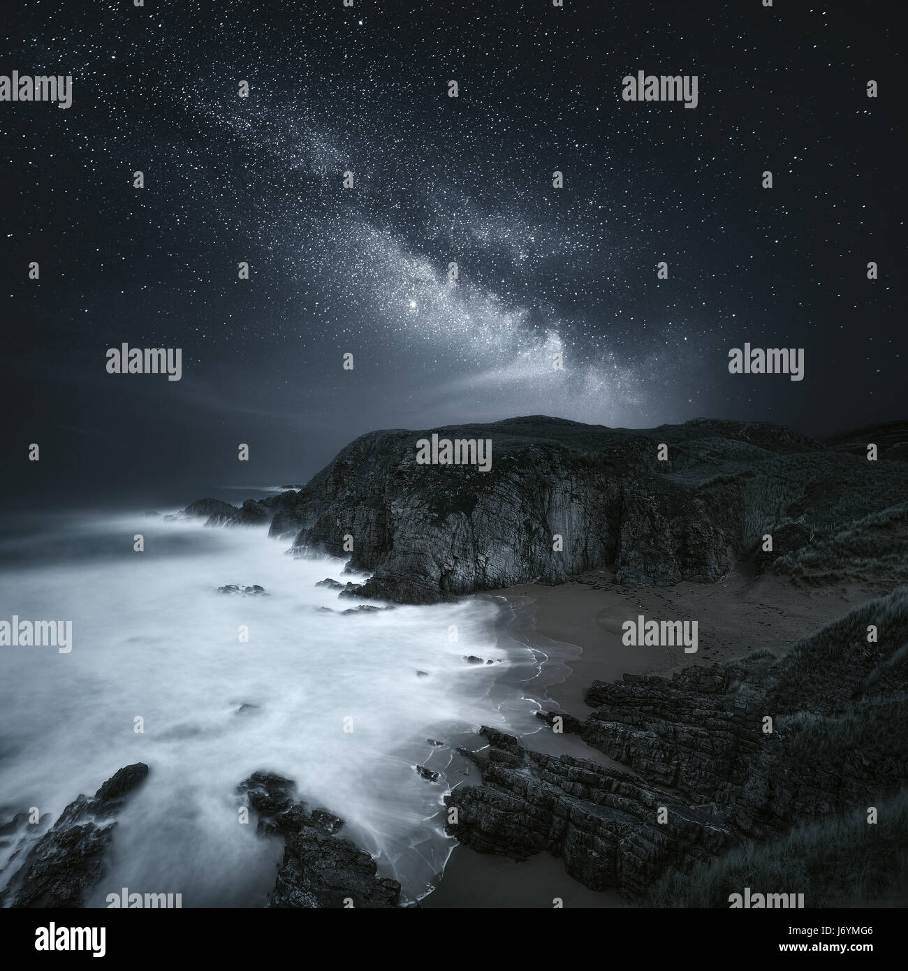 Milky Way over coastline, Donegal Ireland Stock Photo