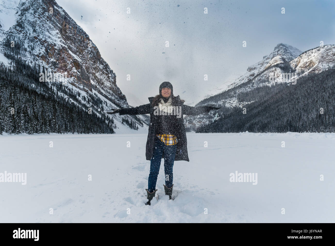 Woman snow lake standing hi-res stock photography and images - Alamy