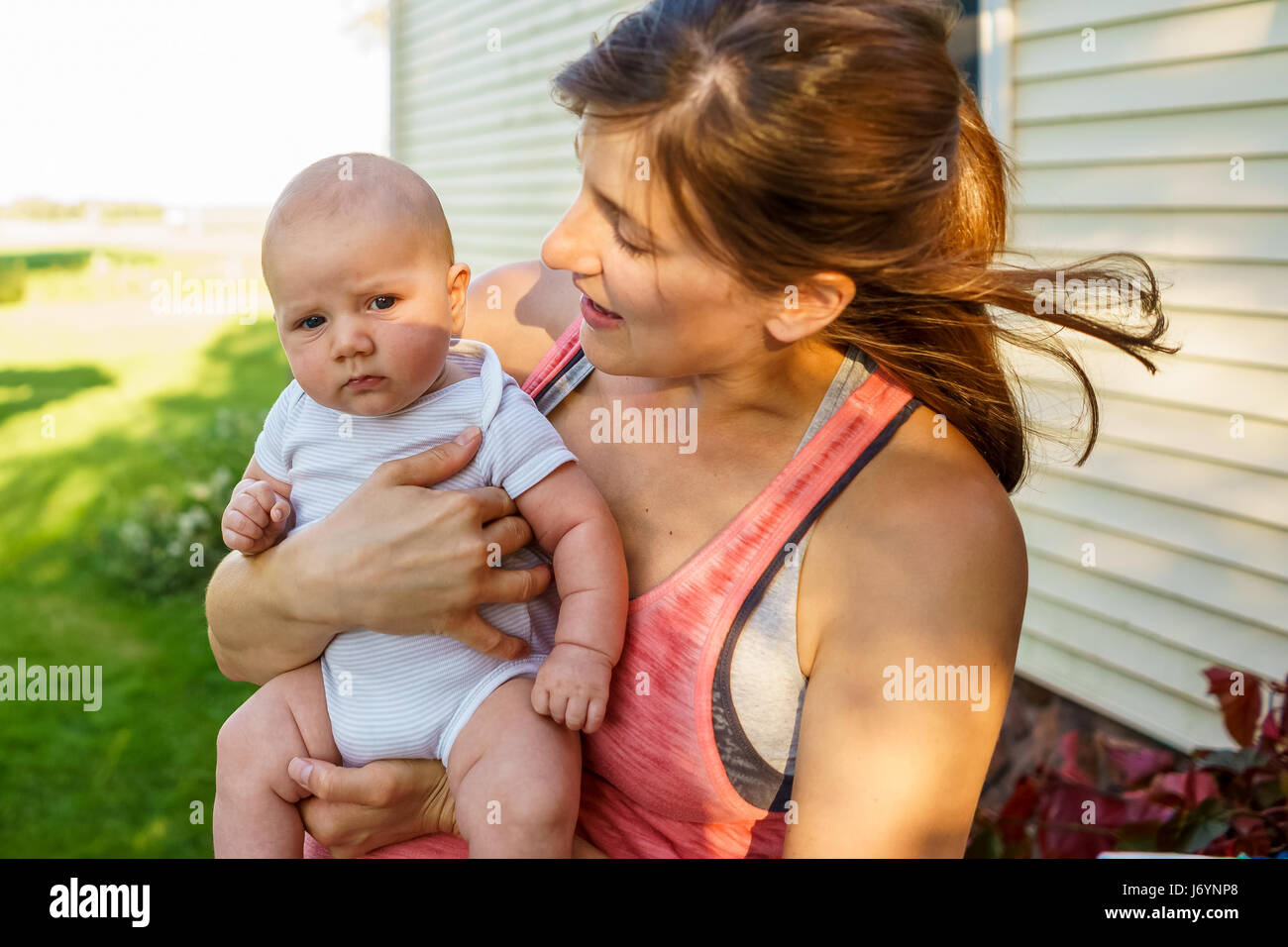 Mother holding her baby son Stock Photo