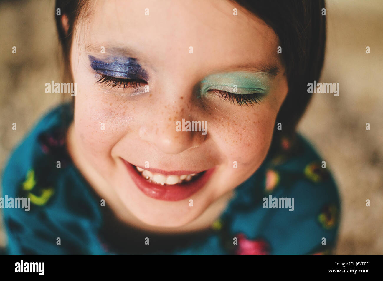 Portrait of a smiling girl wearing eye shadow Stock Photo