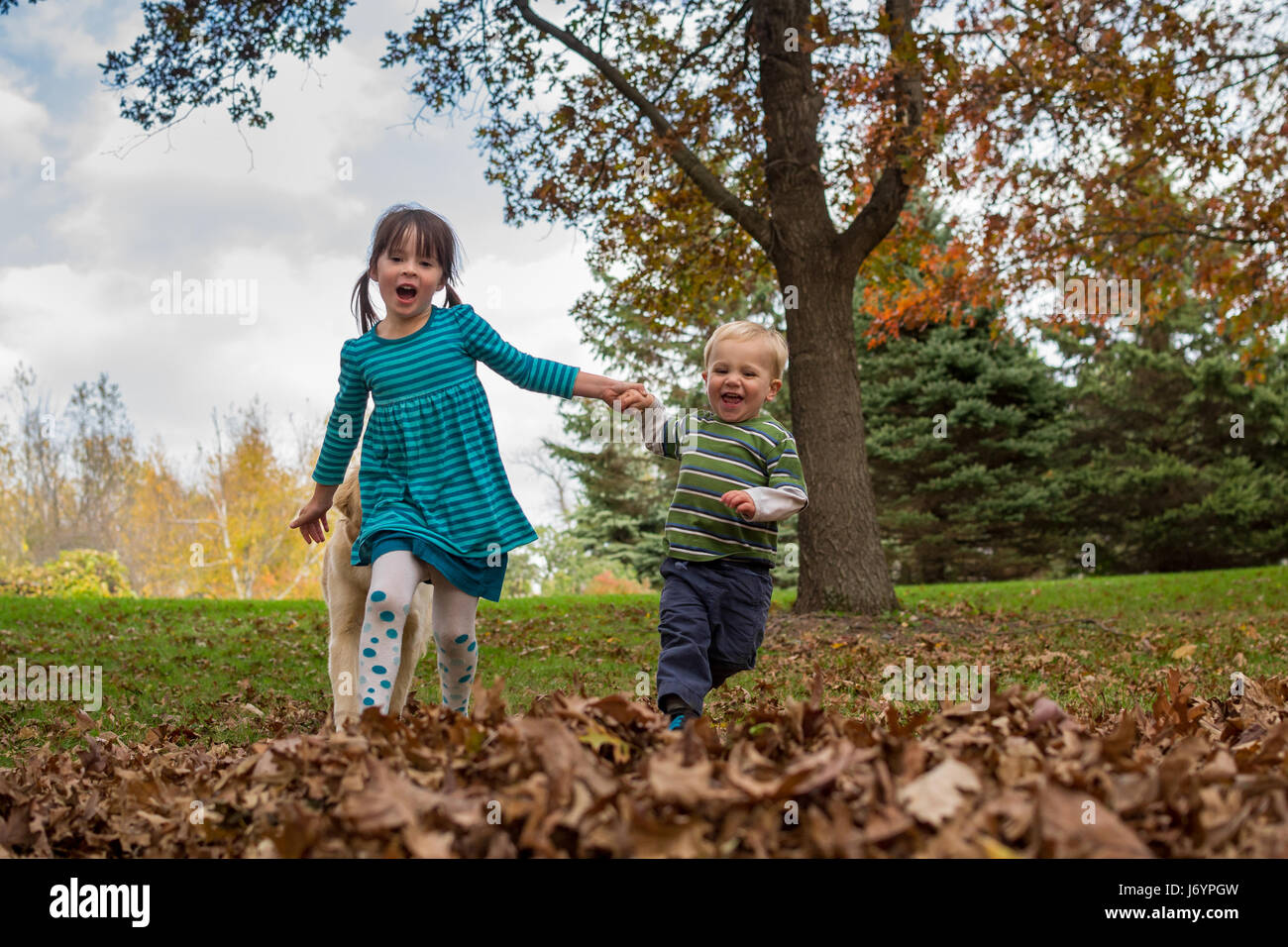 Boy and girl holding hands hi-res stock photography and images - Alamy