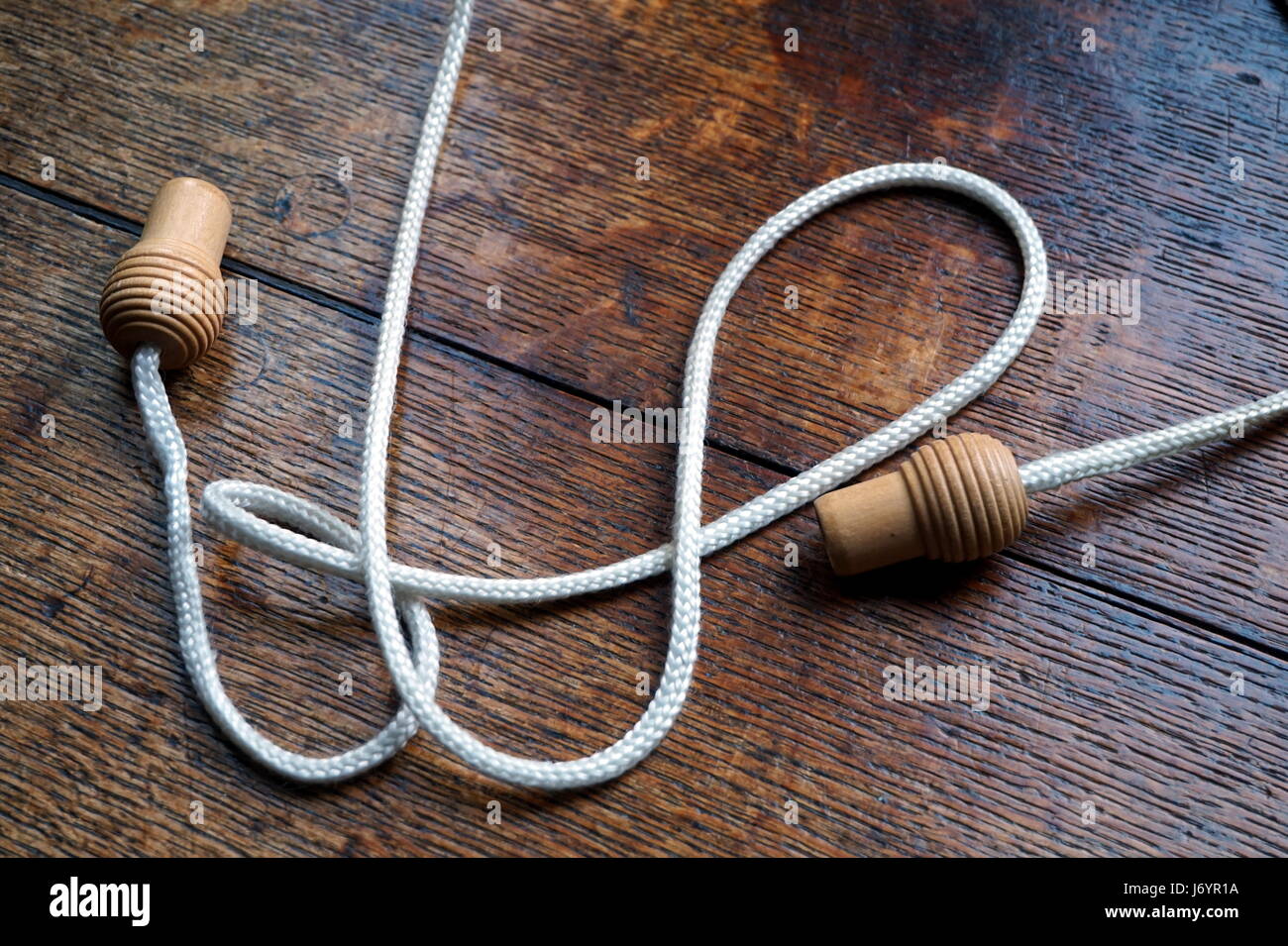 Wooden knobs or handles on a curtain pull cord Stock Photo Alamy