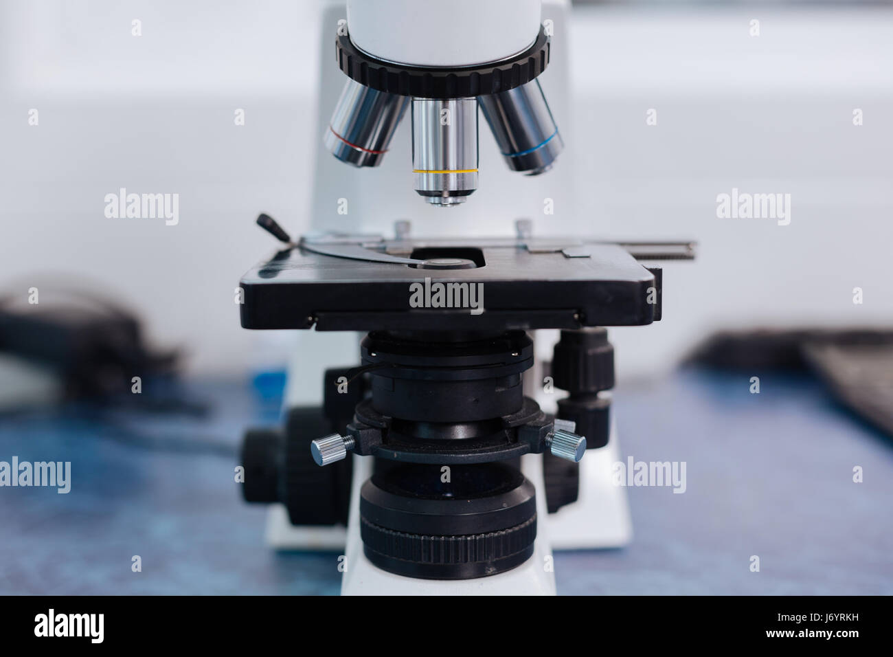 Modern microscope standing on the lab table Stock Photo Alamy