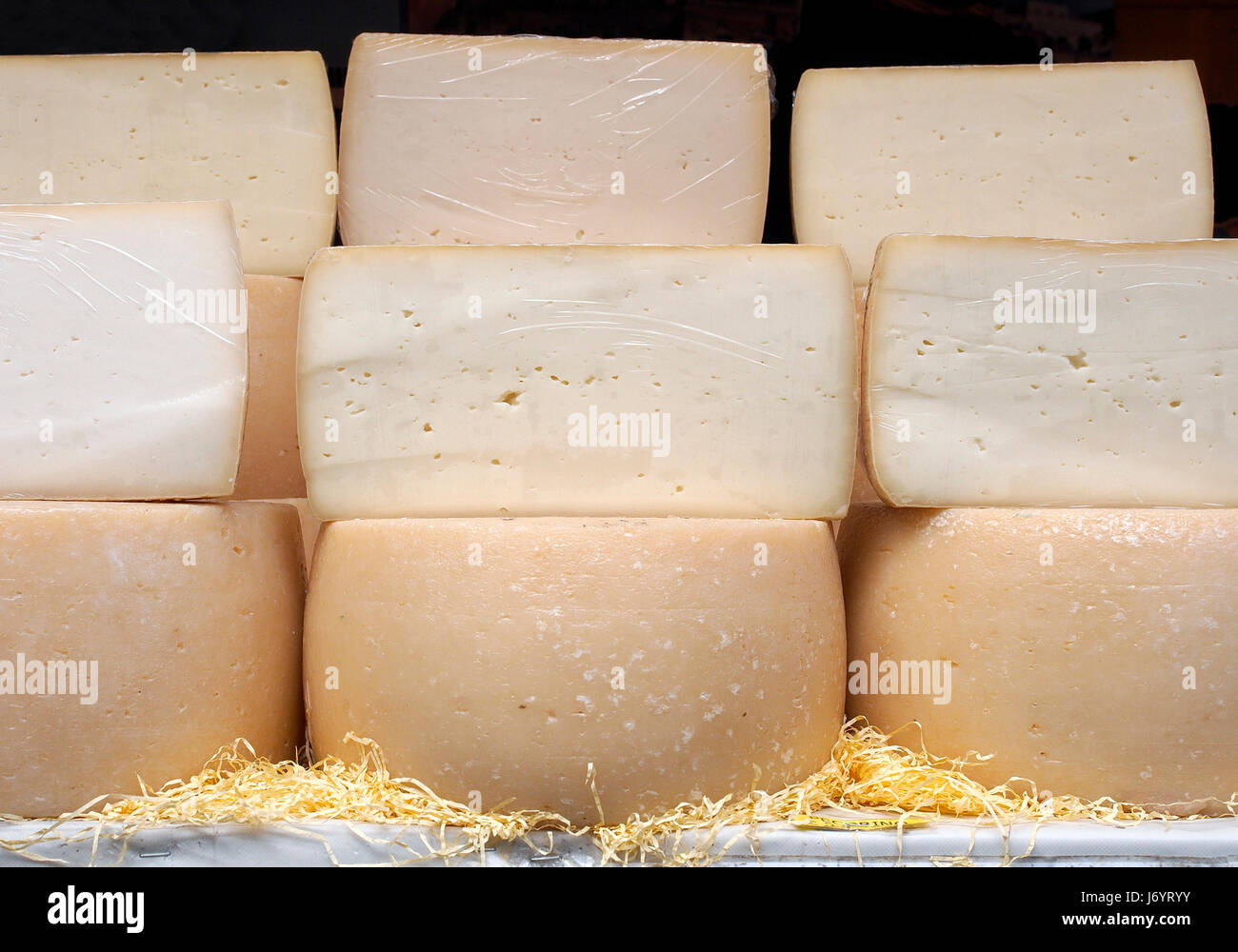 Pecorino, Italian sheep's milk cheese. Some cheese wheels in a street food market. Stock Photo