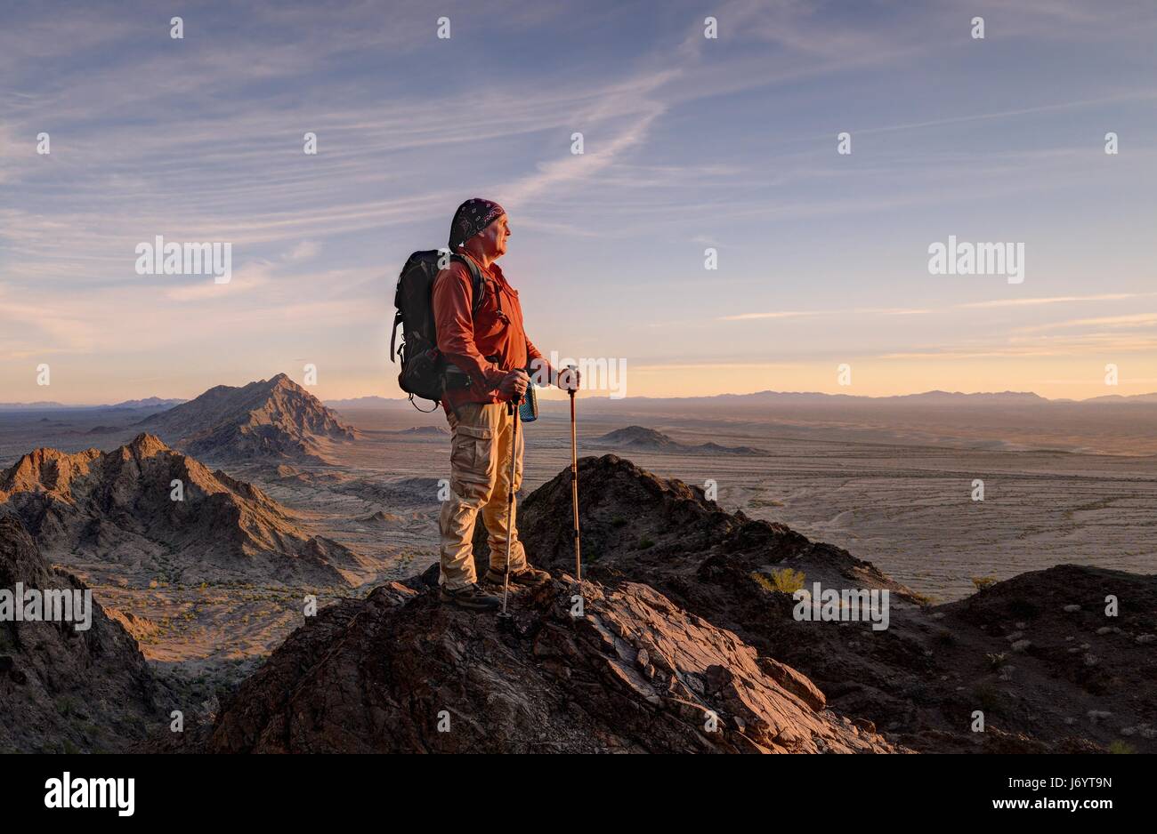 Hiker in the Mohawk Mountains at Sunset, Arizona, United States Stock Photo