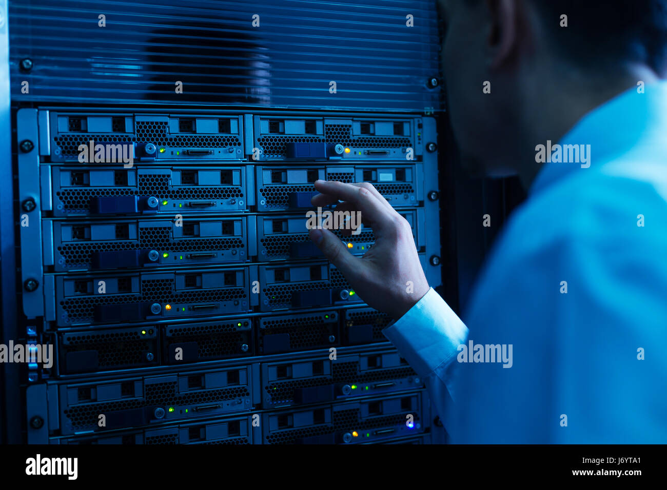 Professional experienced engineer working with network server Stock Photo