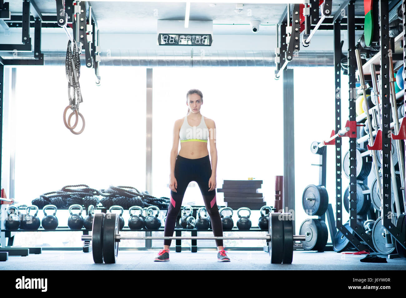 Athletic young woman flexing biceps hi-res stock photography and images ...