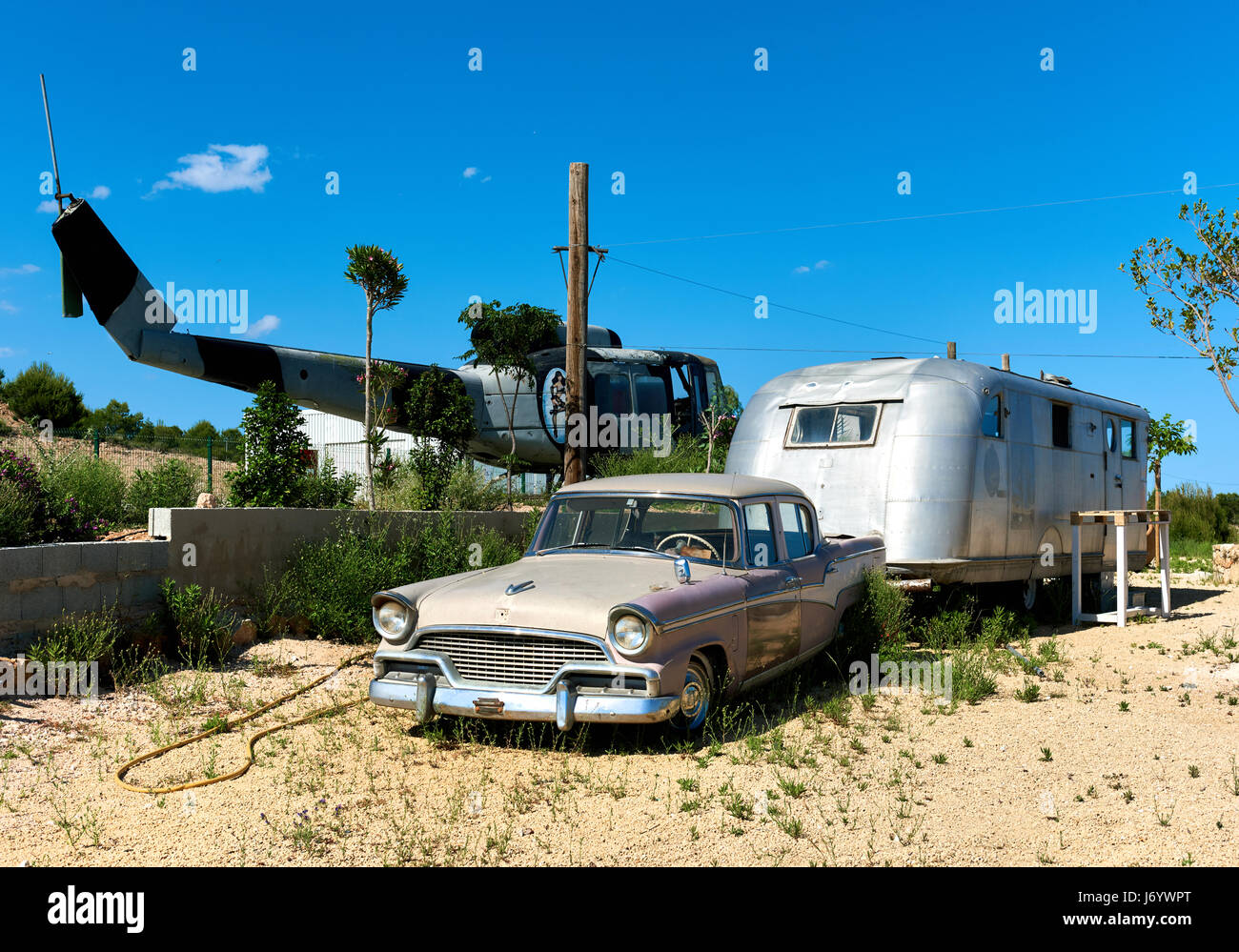 Benidorm, Spain May 13, 2017 Old helicopter and old american classic car in the heliport of