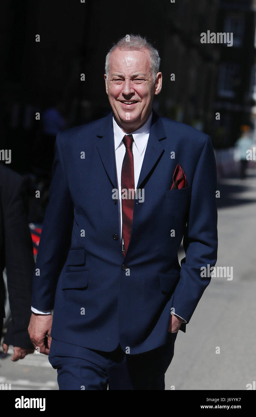 Michael Barrymore leaves the High Court on London, where a judge is to decide the amount of compensation to be paid to the entertainer by Essex Police. Stock Photo