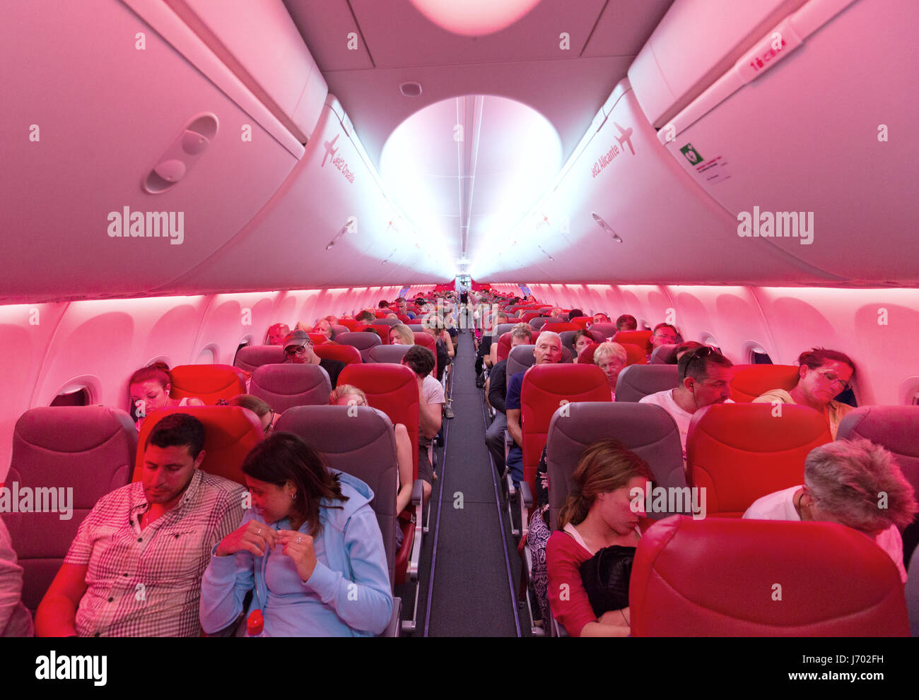 Aircraft passengers in the plane cabin of a Jet2 airline Boeing 737-800 aircraft flying from Lanzarote to the UK Stock Photo