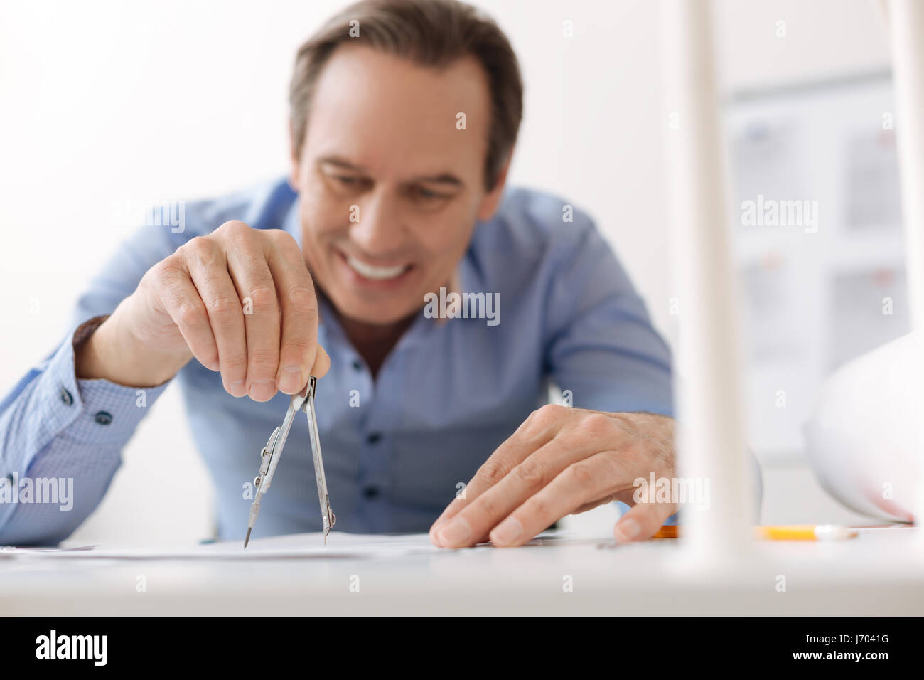 Skillful engineer drawing a blueprint Stock Photo - Alamy