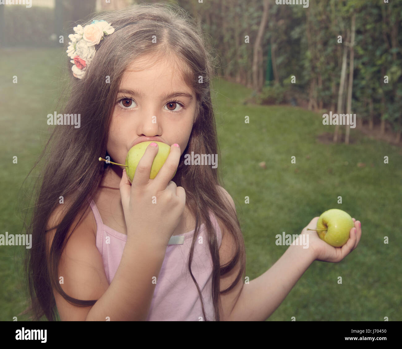 Child eating apple Stock Photo