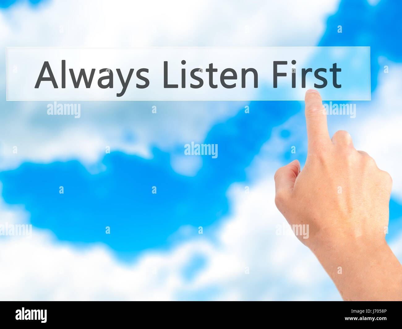 Always Listen First - Hand pressing a button on blurred background ...