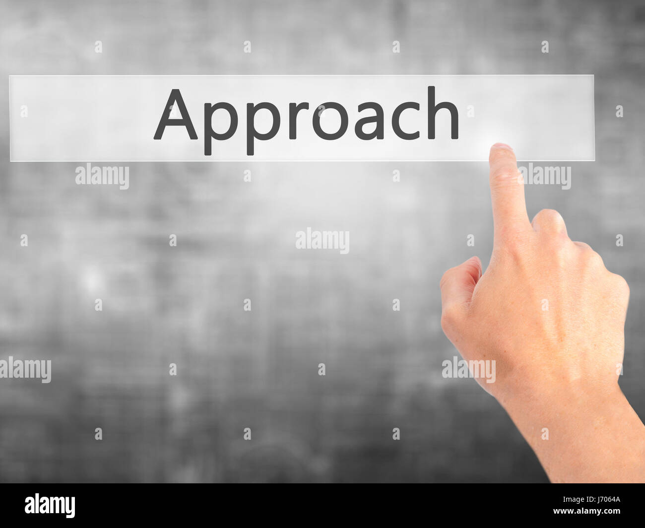 Approach - Hand pressing a button on blurred background concept ...