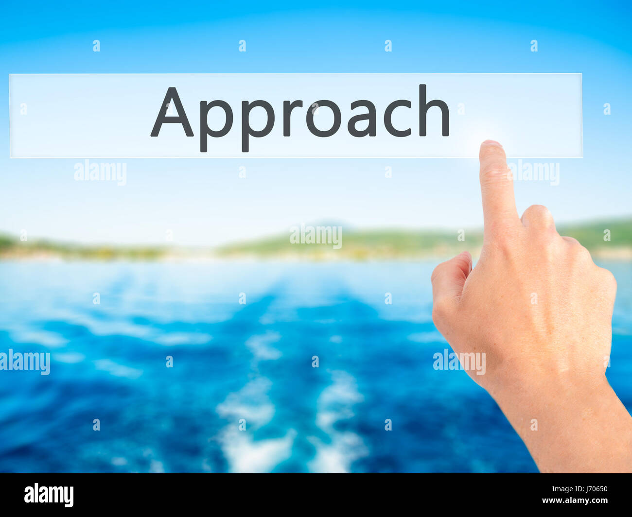 Approach - Hand pressing a button on blurred background concept ...